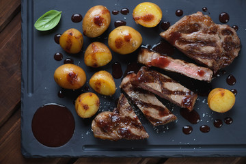 Wall Mural - Top view of sliced medium grilled striploin steak with potato