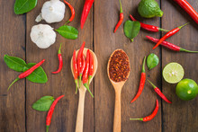 Chili, Garlic And Lime On Wooden Background