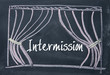 intermission word and curtain background on blackboard