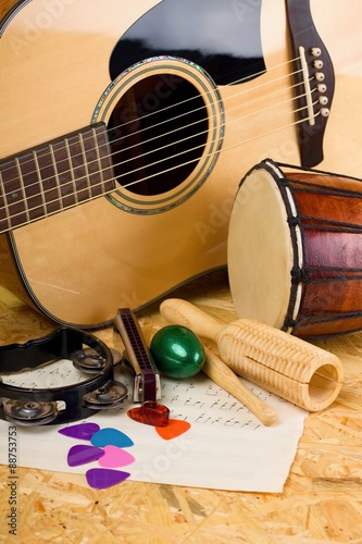 Obraz Dibond Several music instruments on OSB board