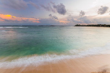 Wall Mural - Colorful sky at sunset on desert tropical beach