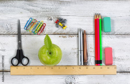 Fotografie, Tablou School supplies in line with ruler on white desktop