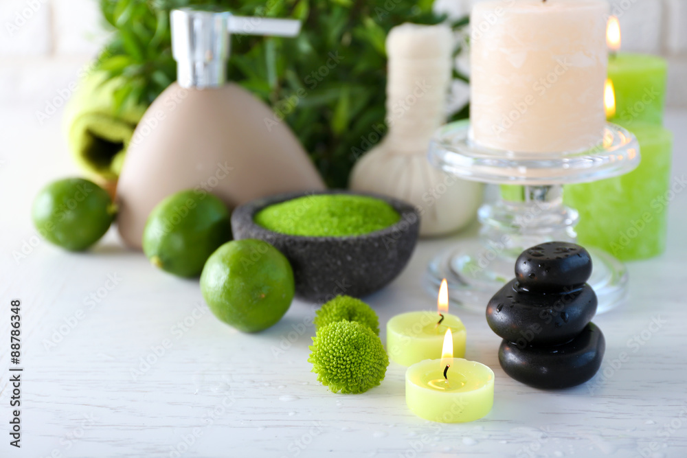 Beautiful composition of spa treatment on white wooden table