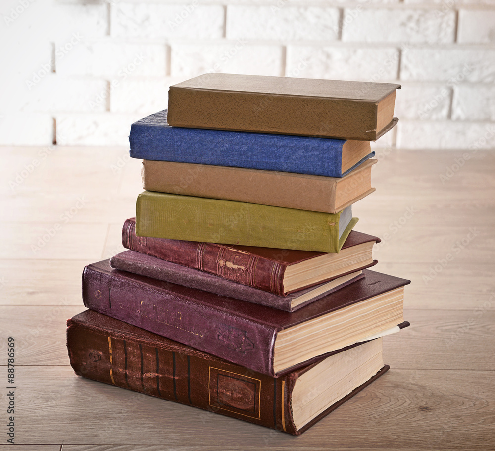 Heap of old books on floor close up