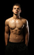 © Africa Studio - Muscle young man on dark background