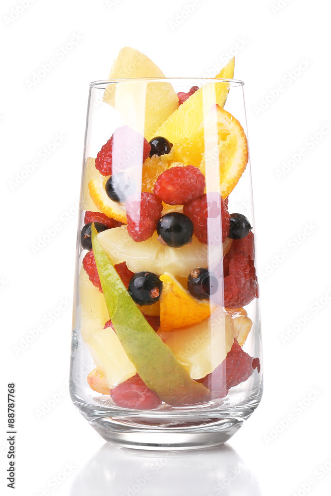 Fresh fruits salad in glass isolated on white