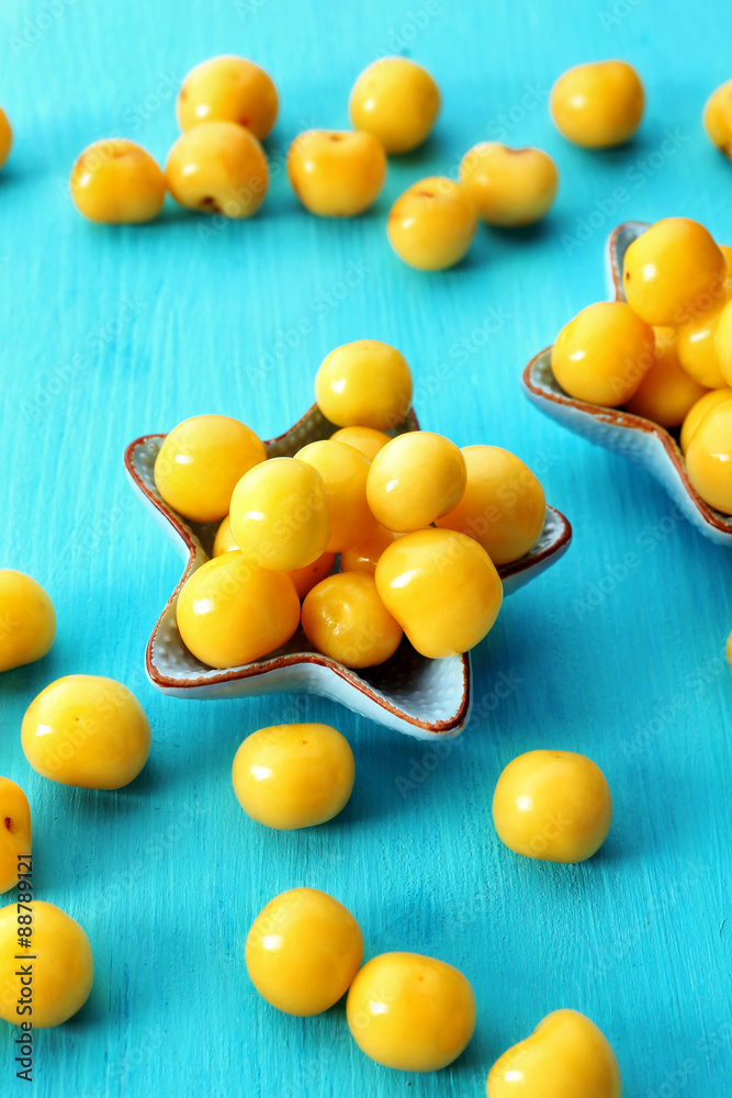 Ripe cherry-plums on wooden table close up