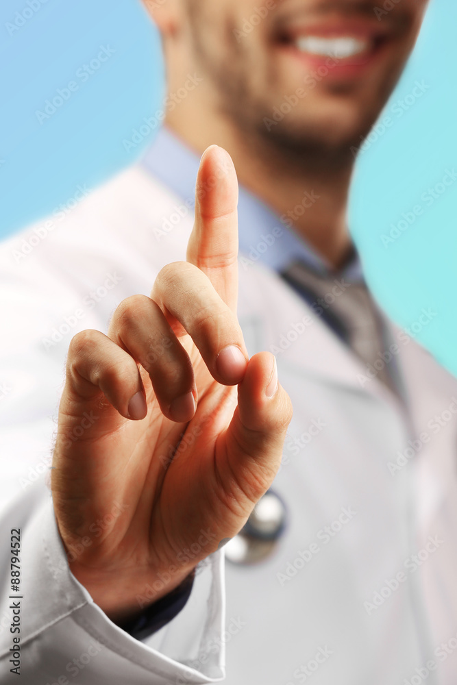 Doctor pointing his finger up, closeup