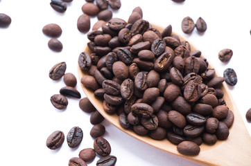 Coffee beans with spoon isolated on white background