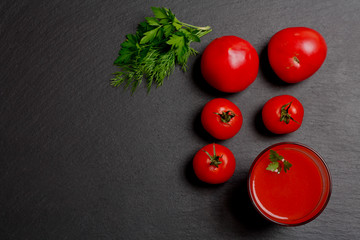 Glass of tasty tomato juice and fresh tomatoes