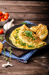 Wall Mural - Herb omelette with chives and oregano sprinkled with Herb omelette with chili flakes