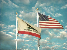 Aged And Worn Vintage Photo Of American And California Flags