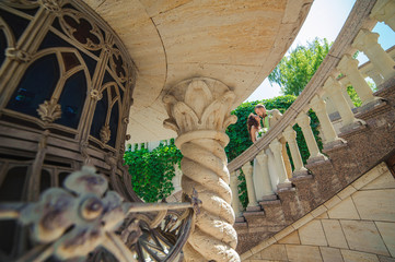 Wall Mural - Bride and groom on the stairs of the castle