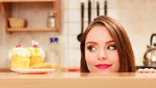Woman Looking At Delicious Sweet Cake. Gluttony.
