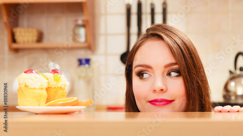 Cuadros en Lienzo Woman looking at delicious sweet cake. Gluttony.