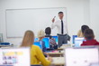 © .shock - students with teacher  in computer lab classrom