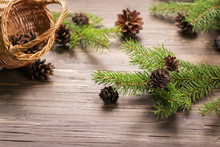 Xmas Concept: Pine Cones And Fir Branches On Wooden Background. Selective Focus. Vintage Style. Toned Image