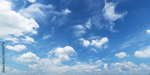 Obraz w ramie White heap clouds in the blue sky.