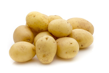 Potatoes on the white background.  New harvest.