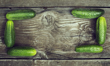 Wood Background With Cucumbers