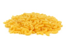 Pile Of Uncooked Dry Macaroni Pasta Isolated On A White Background