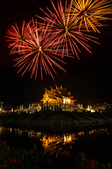 Ho kham luang northern thai style building in Royal Flora temple (ratchaphreuk)in Chiang Mai,Thailand.Firework