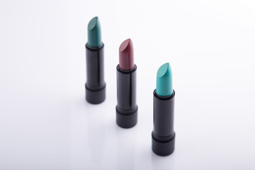 Wall Mural - Row of three lipsticks in bold colors