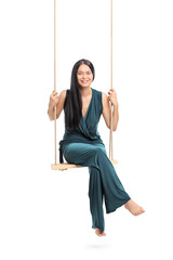 Fashionable woman sitting on a swing