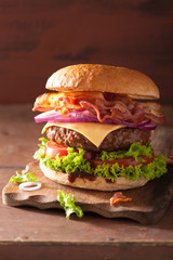 bacon cheese burger with beef patty tomato onion