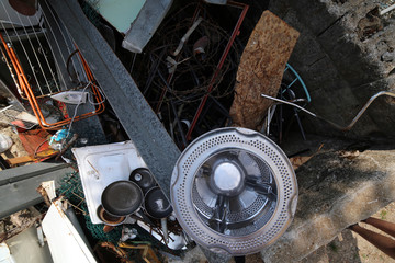 Wall Mural - rusty pans and washing machine basket  in waste landfill