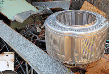 Sticker - washing machine basket and rusty pieces of iron in the landfill