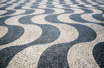 Typical portuguese cobblestone hand-made pavement in Portugal, L