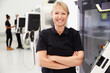 © Monkey Business - Portrait Of Female Engineer Operating CNC Machinery