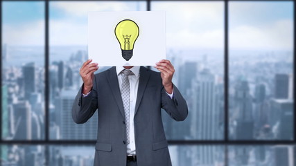 Poster - Businessman holding light bulb animation over face