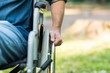 Detail of a man using a wheelchair