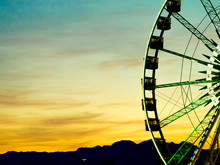 Detail And Silhouette Of Ferris Wheel With Sun Set