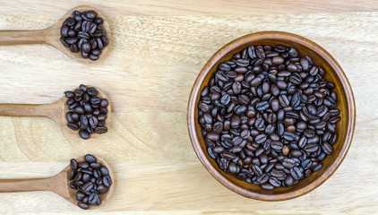 coffee beans and wooden spoon on the table background