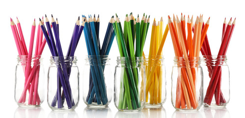 Wall Mural - Bright pencils in glass jars, isolated on white