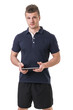 Handsome young personal trainer with tablet PC