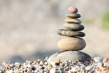 Pile Of Balanced Round Stones On The Beach