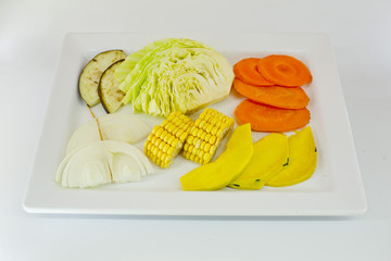 Wall Mural - Slice Mixed vegetables  on white dish isolate