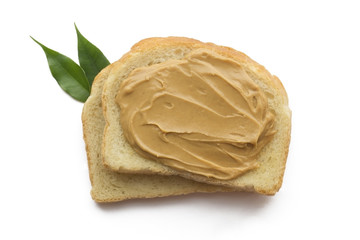 Peanut butter sandwich on each other isolated with green leaf.