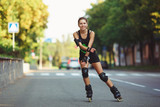 Cheerful girl on roller skates