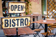 Open Bistro Sign At The Empty Caffe Terrace