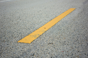 Wall Mural - old asphalt texture with yellow line