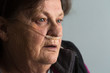 Elderly woman breathing supplemental oxygen