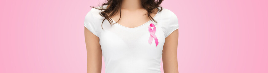 Wall Mural - smiling young woman with cancer awareness ribbon