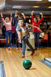 © Syda Productions - happy young man throwing ball in bowling club