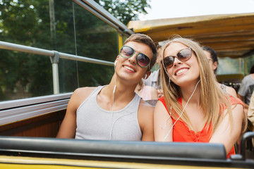 Wall Mural - happy teenage couple traveling by tour bus