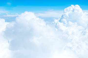 Wall Mural - aerial view of blue sky and cloud top view from airplane window,